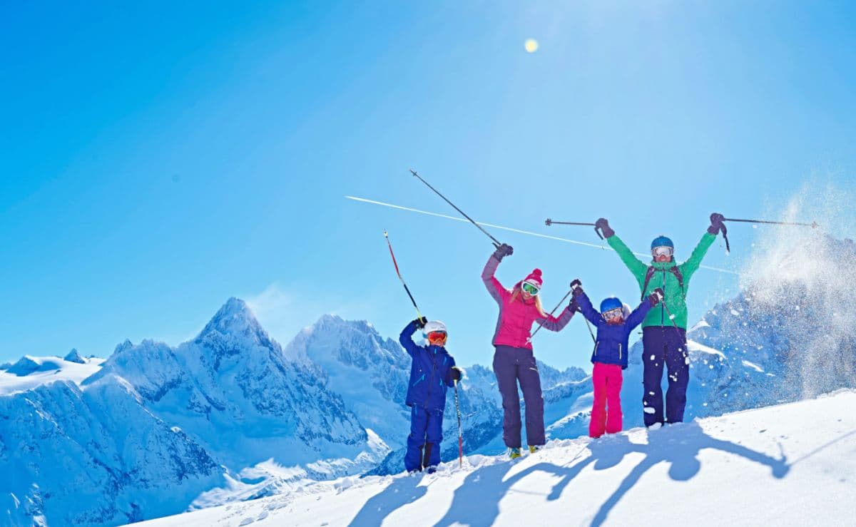 Family enjoying ski holiday together